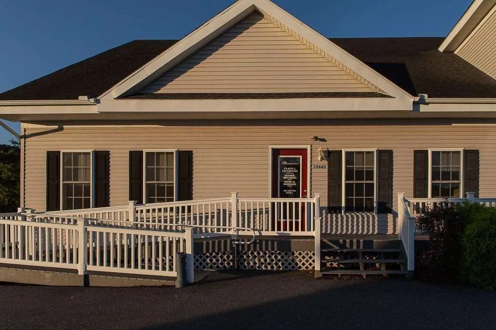 The Rehoboth Beach Dental building on Blue Bird Lane, with its ramp and white railings.