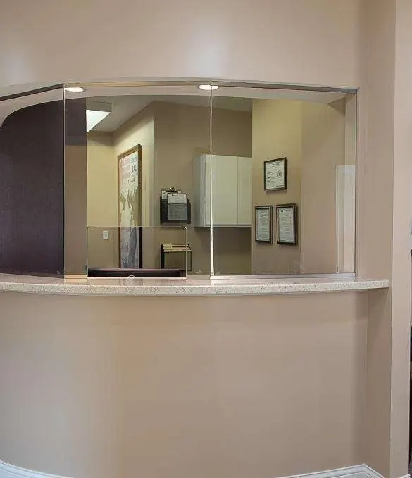 The curved reception window and waiting area.